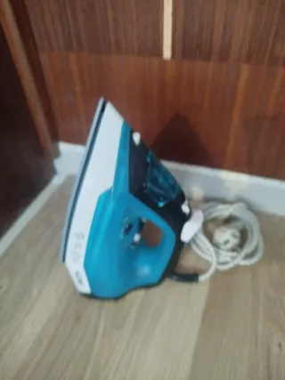 Tabla de planchar con funda y plancha