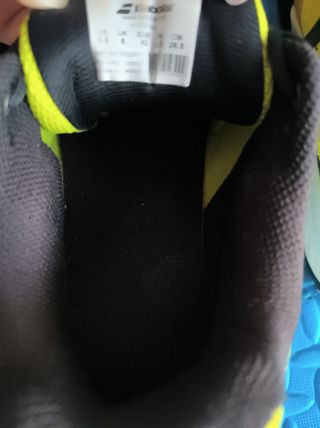 Zapatillas de pádel naranjas y amarillas