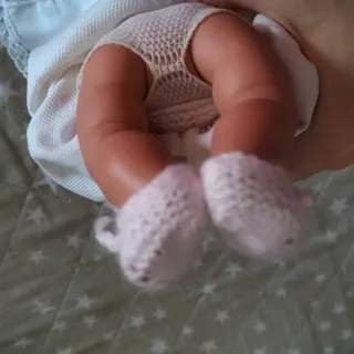 Muñeca bebé de punto rosa