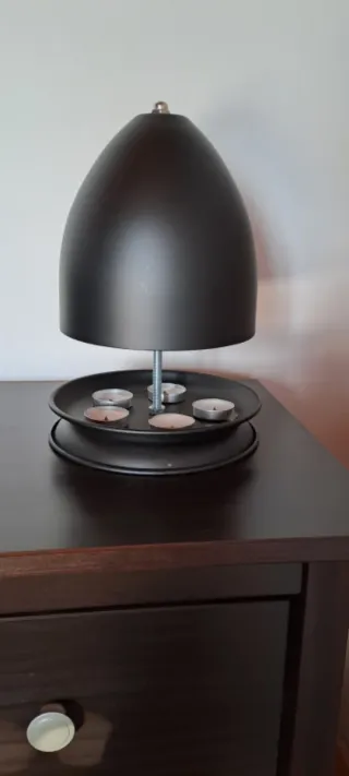 Lámpara calientamanos con velas