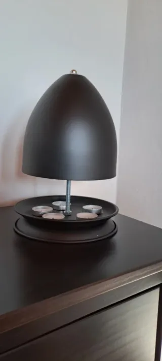 Lámpara calientamanos con velas