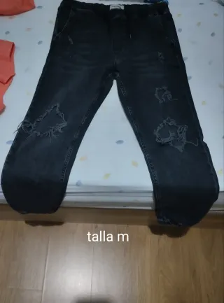 Pantalones vaqueros grises rotos talla M