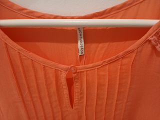 Blusa manga larga rosa.