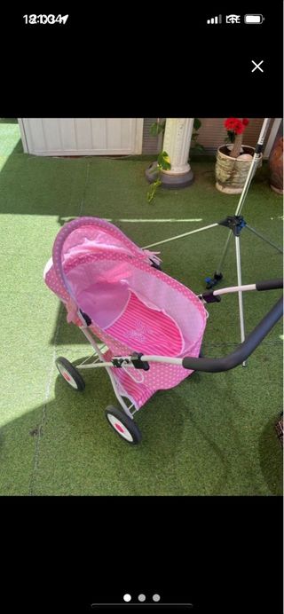 Carro de muñecas rosa