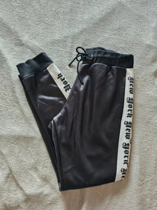 Pantaloni tuta neri con banda laterale
