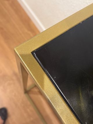 Mueble de hierro para entrada negro y dorado