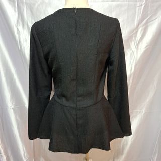 Blusa peplum elegante manga larga