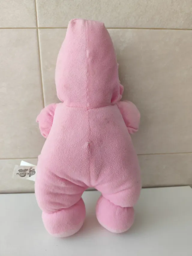 Muñeca de trapo rosa con caballito
