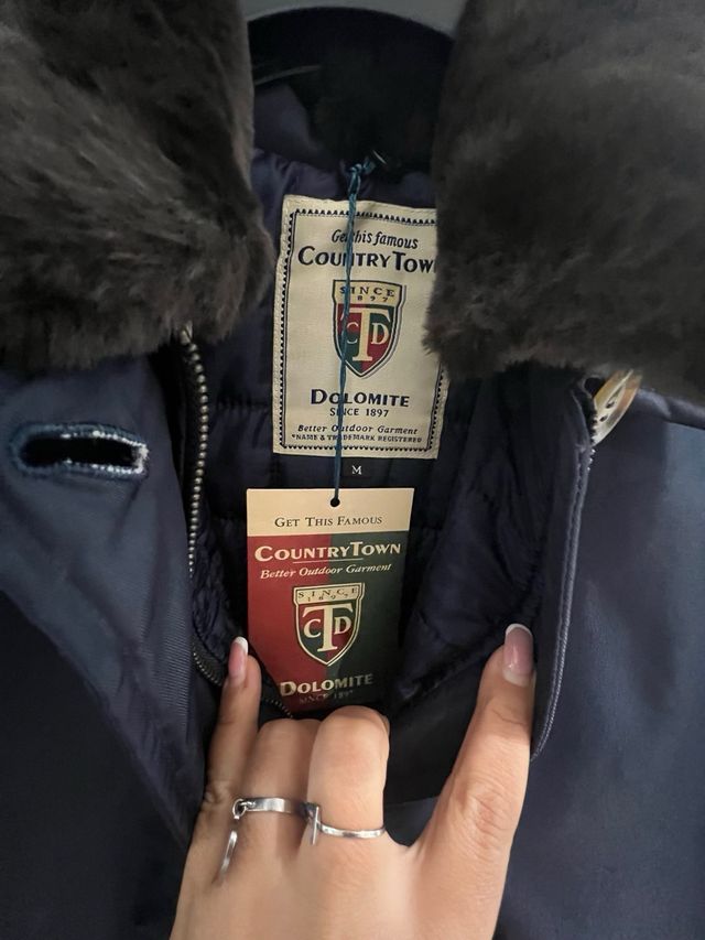 Giubbotto blu con collo marrone