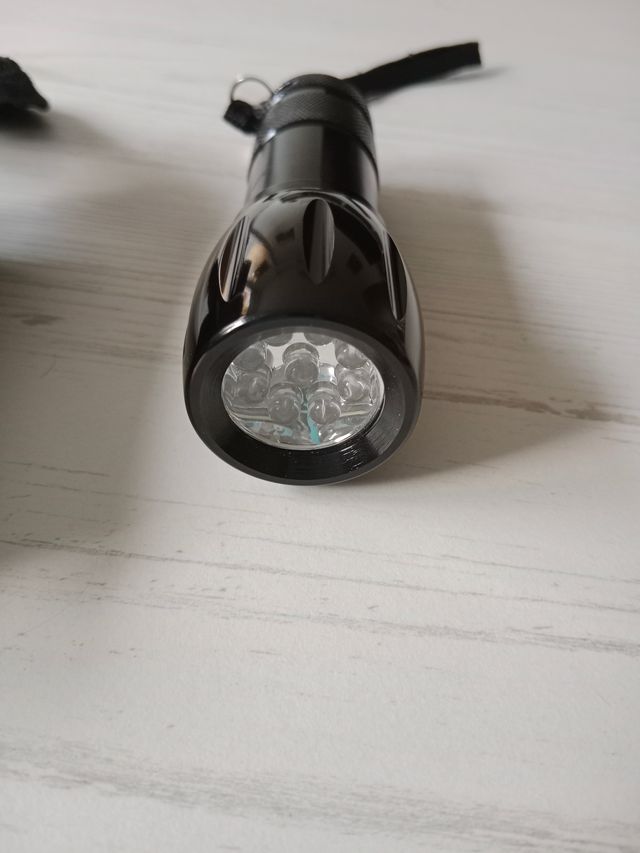 Linterna escudo CNP y  funda