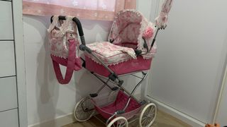 Cochecito de muñecas rosa con bolso