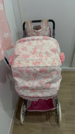 Cochecito de muñecas rosa con bolso