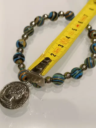Bracciale con ciondolo moneta