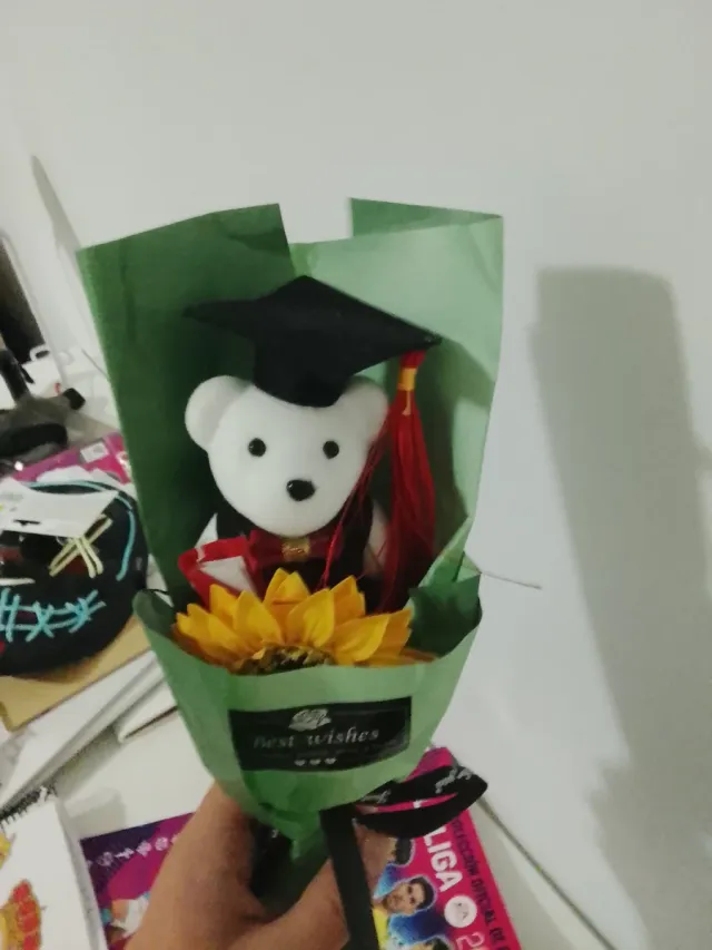 Oso de peluche graduado con girasol