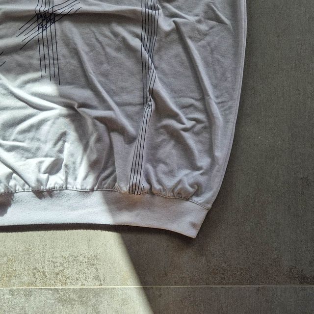 Polo “Australia” blanco con bolsillo y bordados