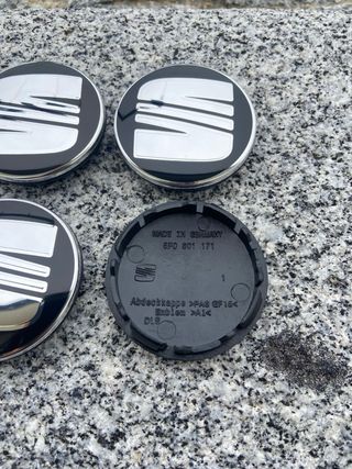 Tapabujes Seat 56mm Negro Plata nuevos