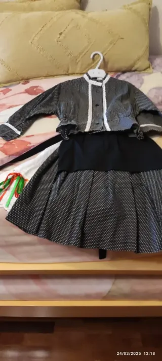 Traje de vasquita infanti talla 4