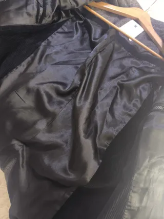 Abrigo paño jaspeado gris.