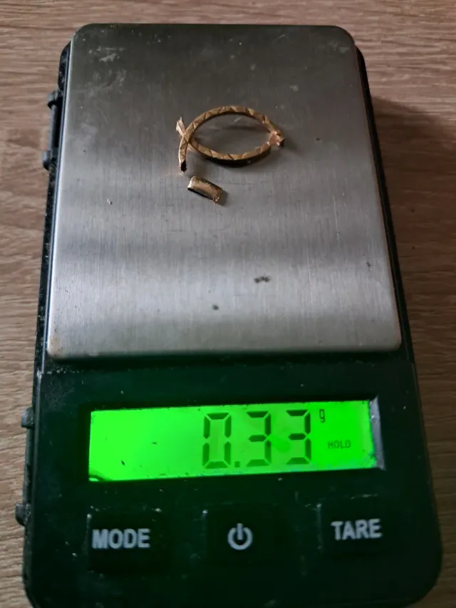 Chatarra de oro 18k - 0.33g.