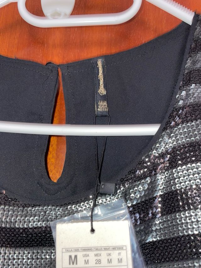 Blusa lentejuelas negra y plateada