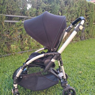 Bugaboo Bee5, capotas rosa y negra y colchoneta