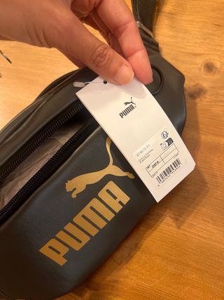 Riñonera Puma Negra y Dorada