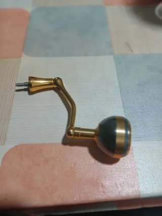 Manivela dorada carrete pesca