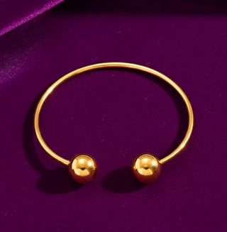 Pulsera dorada ajustable con esferas