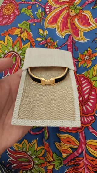 Pulsera Hermes Clic H Negra y Dorada