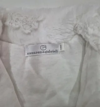 Pelliccetta bimba bianca con fiocchi