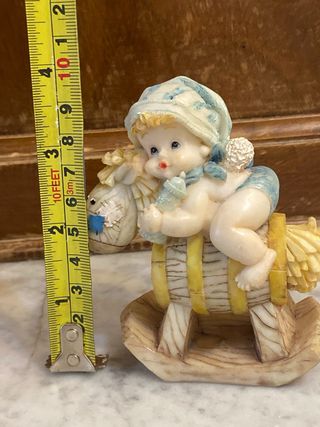 Figurina bimbo su cavalluccio resina