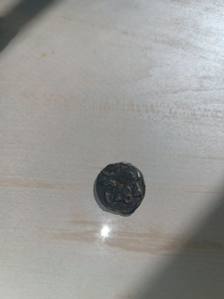 Moneda antigua con estrella de 6 puntas