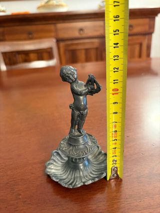 Putto vintage in peltro con lira