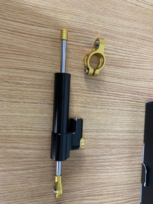 Amortiguador Dirección Universal, como nuevo.