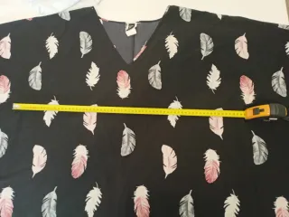 Blusa tipo poncho Plumas