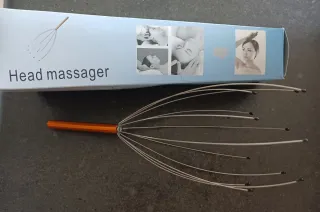 Massaggiatore per testa arancione