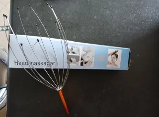 Massaggiatore per testa arancione