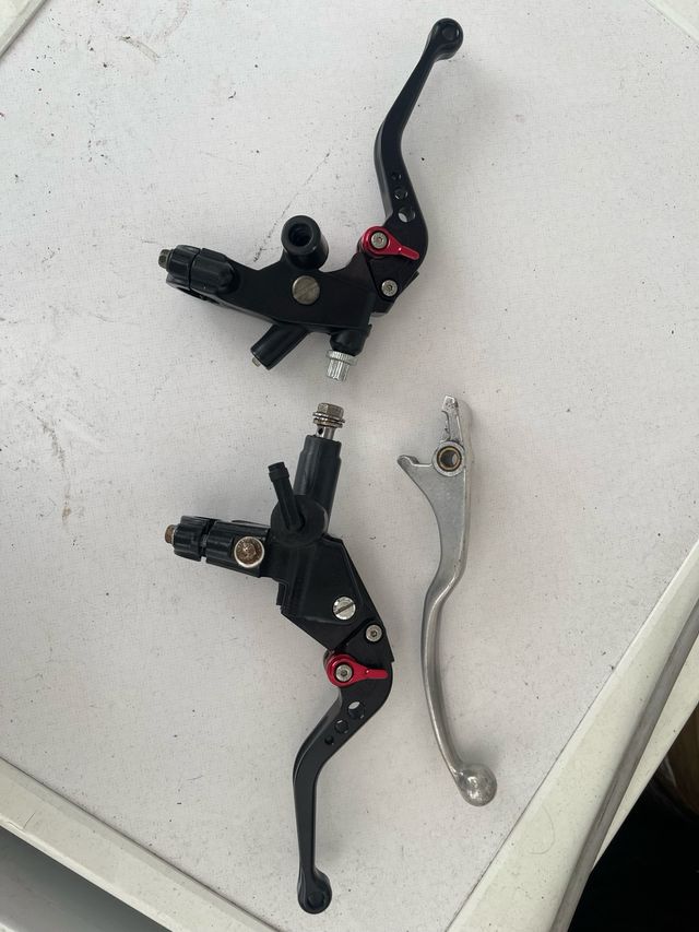 Leve per moto regolabili