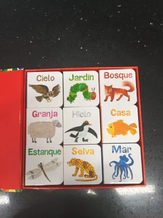 Una caja con muchos libros y un puzzle (Spanish...