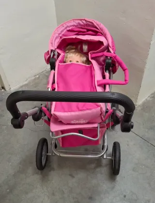 Carro de muñecas rosa