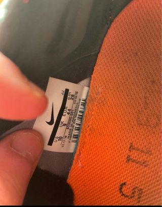 Zapatillas running Nike EXP grises y naranjas