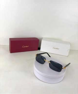 Gafas de sol Cartier negras y doradas