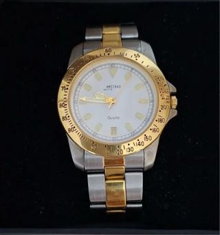 Reloj Amstrad Oro y Plata