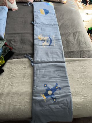 Juego de cuna azul con dibujos