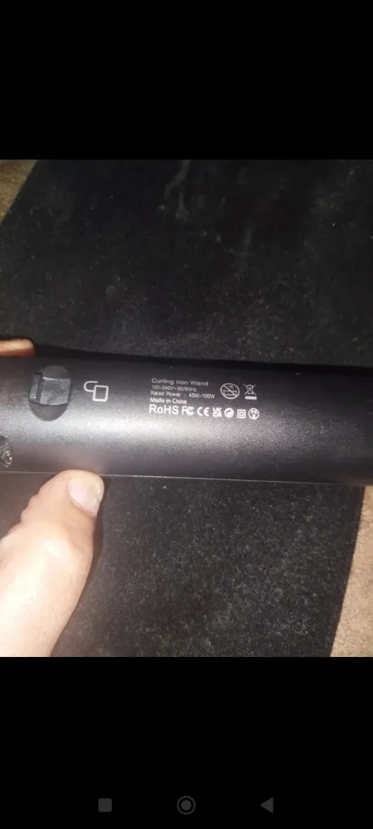 Rizador de pelo negro y rosa