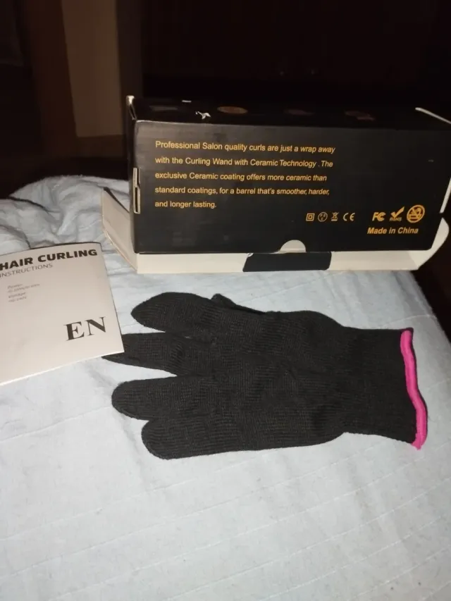 Rizador de pelo negro y rosa