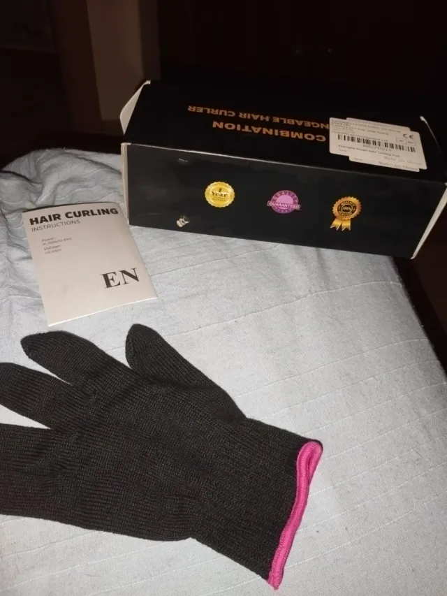 Rizador de pelo negro y rosa