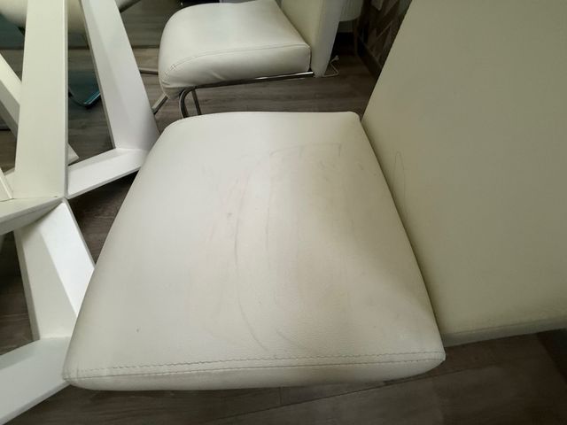 Mesa cristal y 6 sillas blancas nuevas polipiel