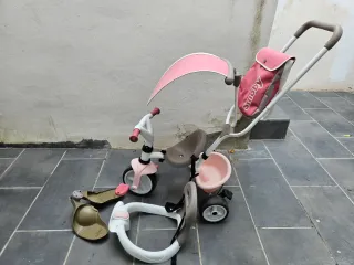 Triciclo Smoby rosa con accesorios