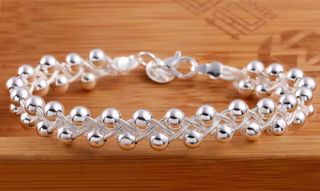 Pulsera semirrígida doble con bolas